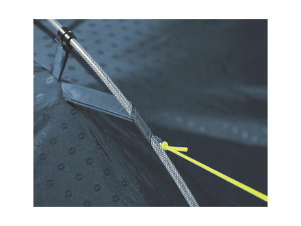 Close-up of a tent mesh with a stake and yellow arrow pointing to it, on a dark background.