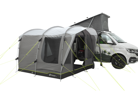 Van with a gray and black camping trailer attached on a white background