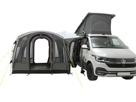 Van with an attached camping tent on a white background