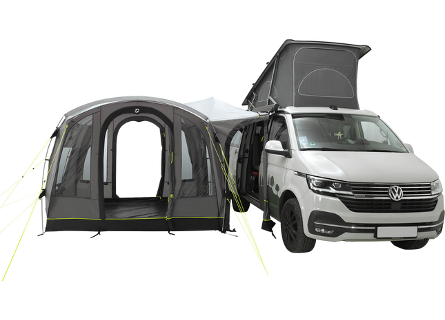 Van with an attached camping tent on a white background