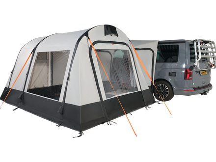 white and black drive away awning attached to a campervan