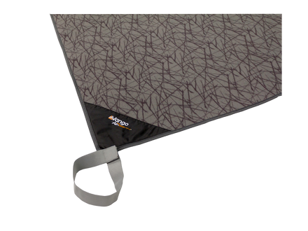 A close-up of a gray and black patterned picnic blanket with a black corner and a gray carrying loop, featuring the Mango Picnic logo.
