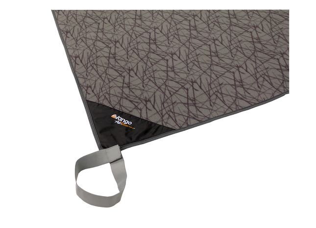 A close-up of a gray and black patterned picnic blanket with a black corner and a gray carrying loop, featuring the Mango Picnic logo.