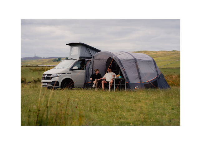 white campervan with grey awning attached