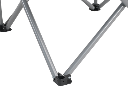 Close-up of a metal folding chair frame on a white background