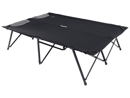 Black camping cot on a white background