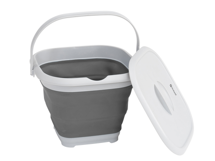 Collapsible gray trash bin with a white lid on a white background