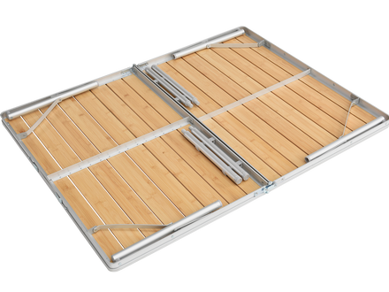 Foldable wooden table with metal frame on a white background