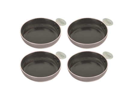 Set of four black tapas pans on a white background