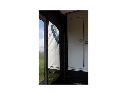 awning support bar with a view of grass and sky outside