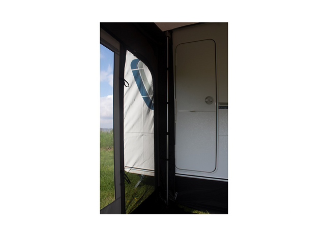 awning support bar with a view of grass and sky outside