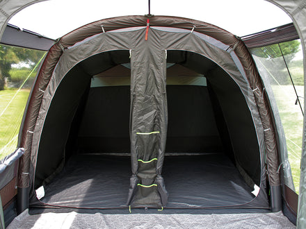 Camping tent interior with a partially open door, showing the inside space.