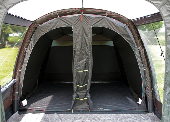 Camping tent interior with a partially open door, showing the inside space.