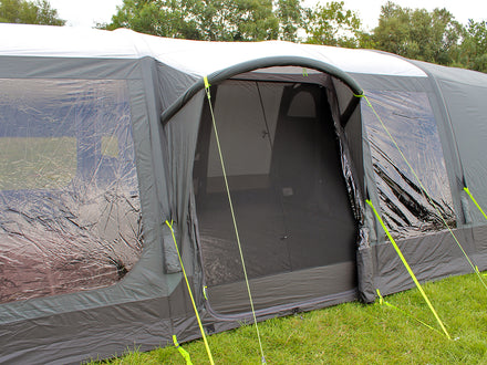 Camping tent with screen porch on a grassy area