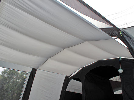 Close-up of a tent canopy with rain protection, showing texture and material details.