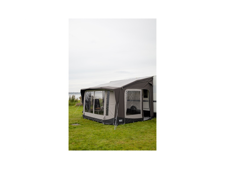 Caravan awning on a grassy area with a white background