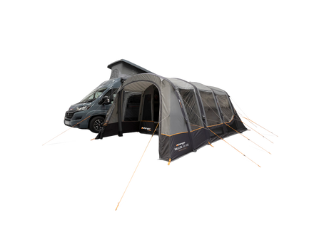 A dark gray and black air awning, shown pitched beside a dark gray motorhome on a plain white background.