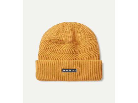 Yellow beanie with a brand label on a white background