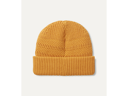 Mustard yellow knit beanie on a white background