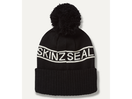 Black beanie with pom-pom and 'SKINZSEAL' branding on a white background