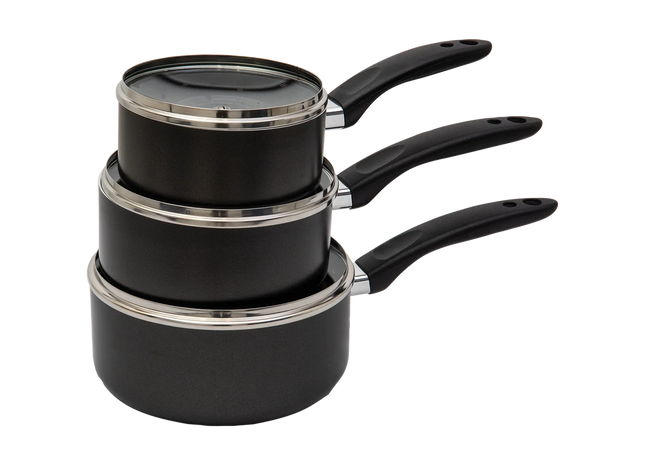 Three nested black saucepans with glass lids and black handles, stacked on a plain white background.