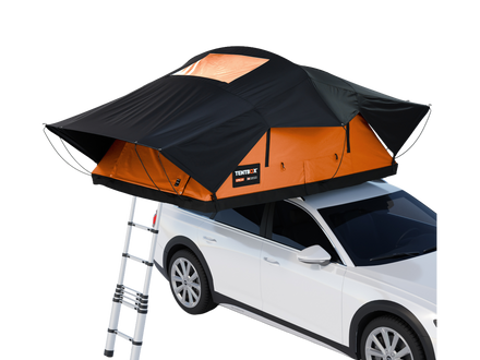 A black and orange rooftop tent mounted on top of a white SUV, with a silver ladder extended below. The tent has a black outer canopy and bright orange interior walls, with a small visible brand patch reading Tents+.