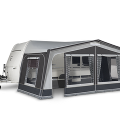 Caravan with an attached awning on a white background