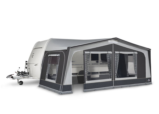 Caravan with an attached awning on a white background