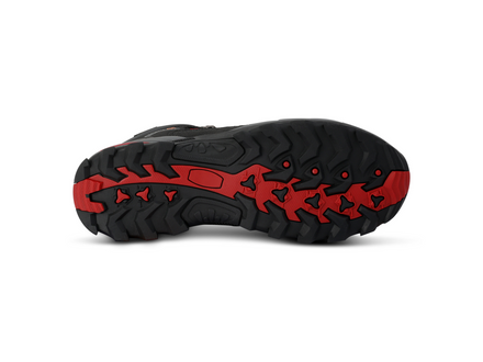Black and red sole of a shoe on a white background