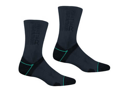 Pair of black socks with green accents on a white background