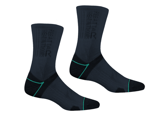 Pair of black socks with green accents on a white background