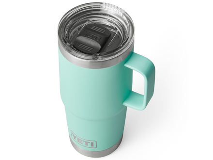 Turquoise YETI mug with a clear lid on a white background