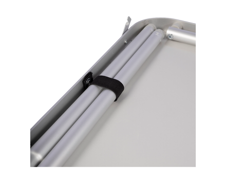 underside of a camping table and legs with a black strap on a white background