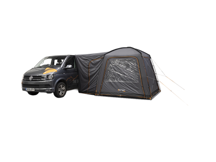 A dark gray VW camper van with an attached black and gray awning tent featuring a clear window, shown on a plain white background.