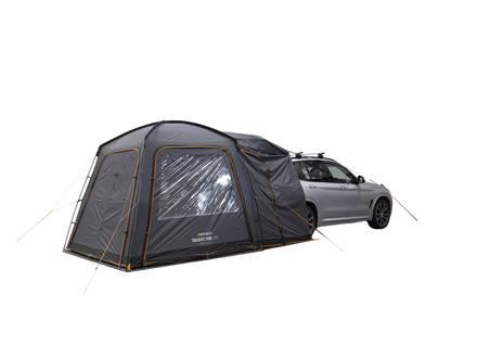 A dark gray car tent attachment shown beside a silver SUV on a plain white background. The tent is pitched over the side of the vehicle with a large clear window panel and visible guy lines.