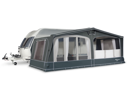 Caravan with a large awning on a white background