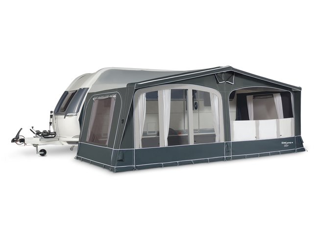 Caravan with a large awning on a white background