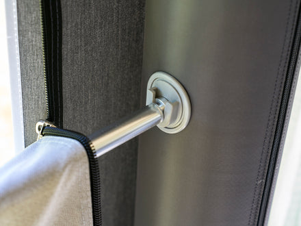Close-up of a screen veranda bar lock mechanism.