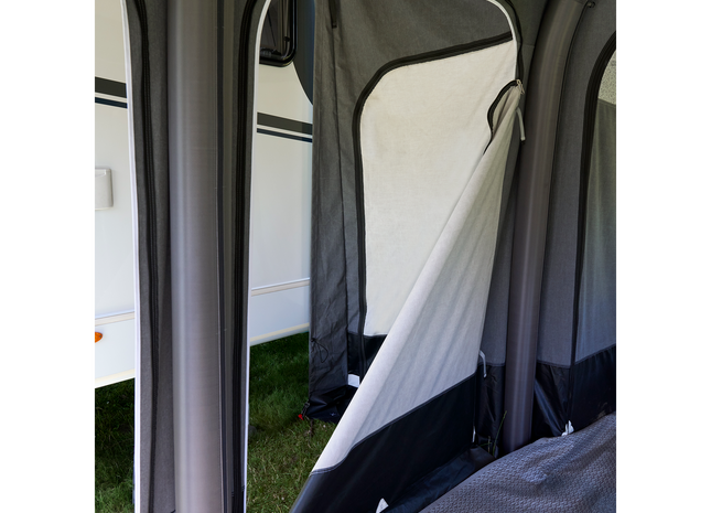 Camping tent interior with a view of the outside through the door