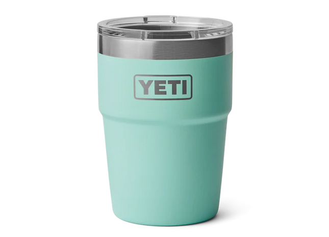 Mint green YETI tumbler with a silver lid on a white background