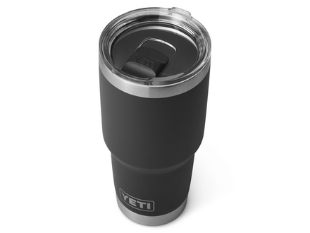 Black YETI tumbler with a clear lid on a white background