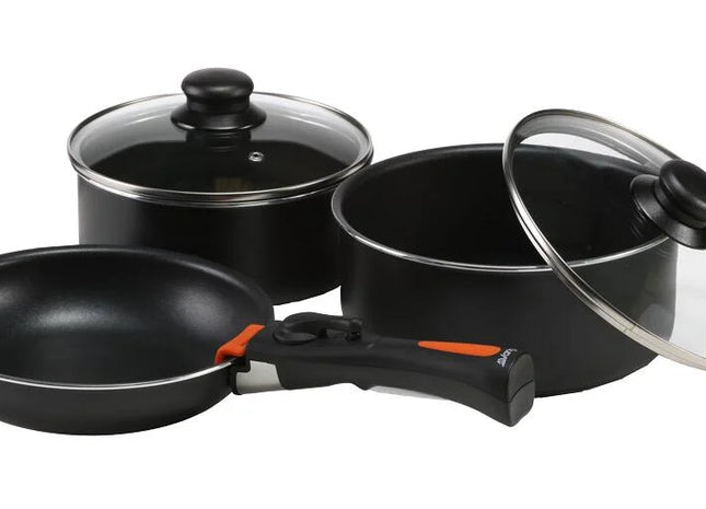 black metal cooking pot set with glass lids on a white background