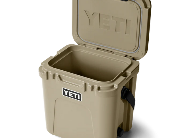 Tan YETI cooler with open lid on a white background